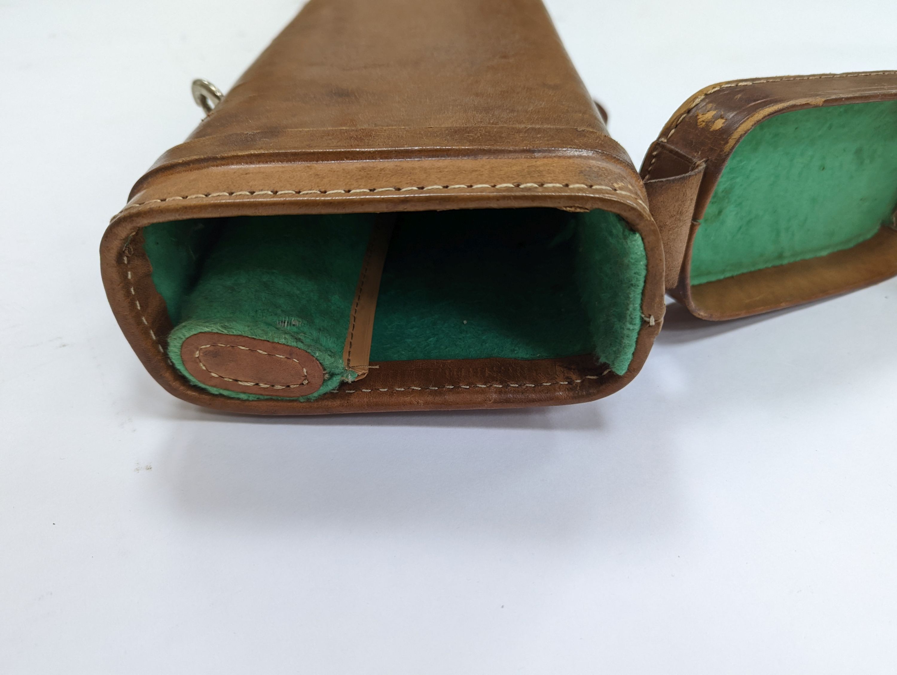 A leg of mutton shaped leather gun case
